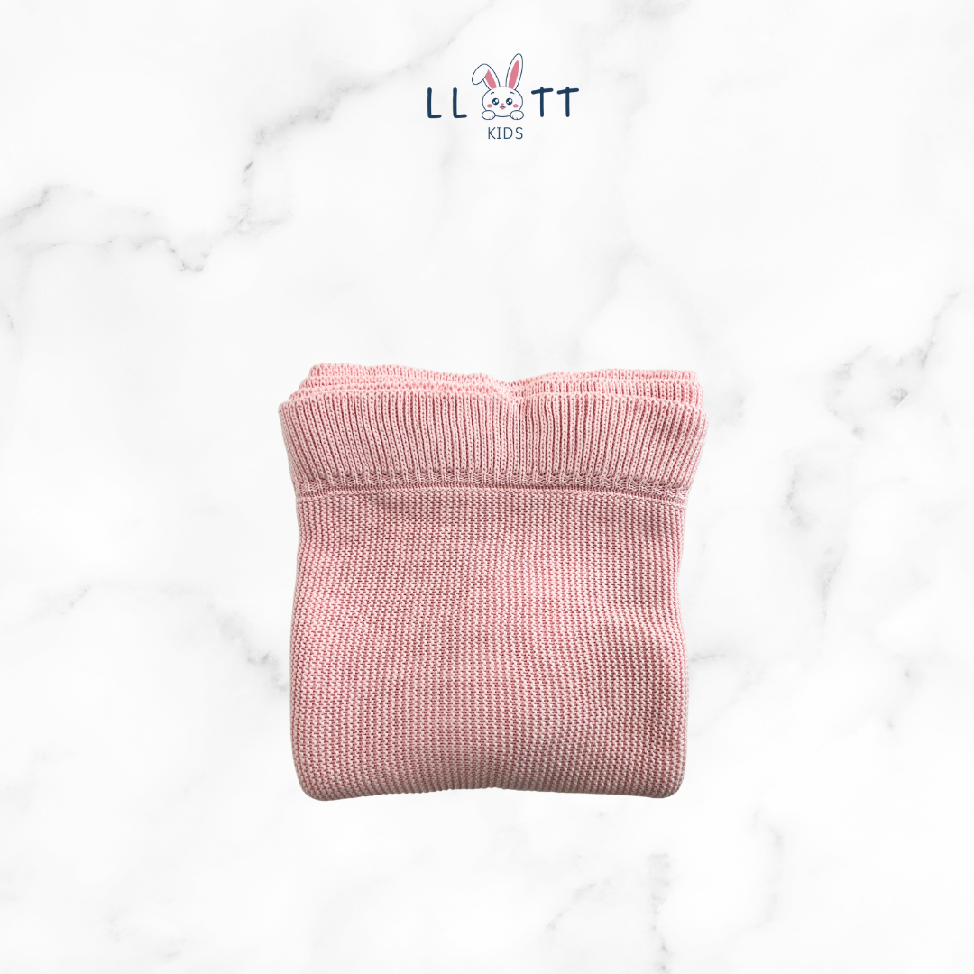 Light pink woven blanket