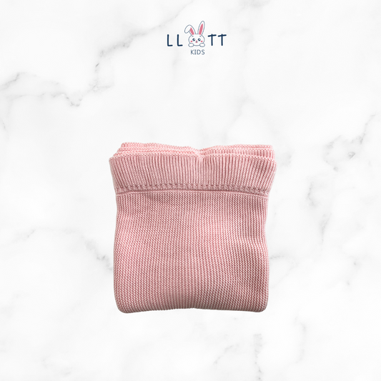 Light pink woven blanket